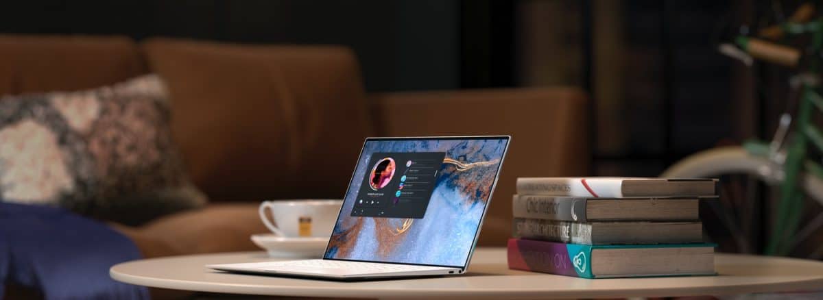 laptop on brown wooden table