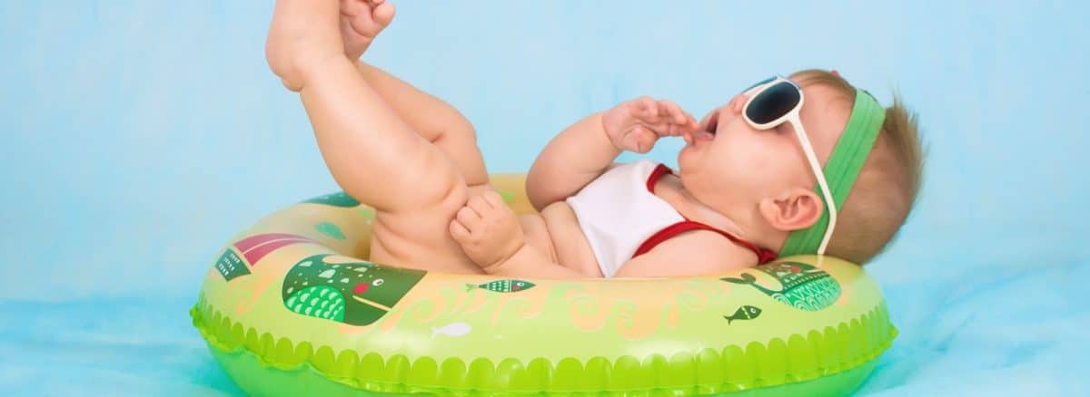 baby lying on inflatable ring