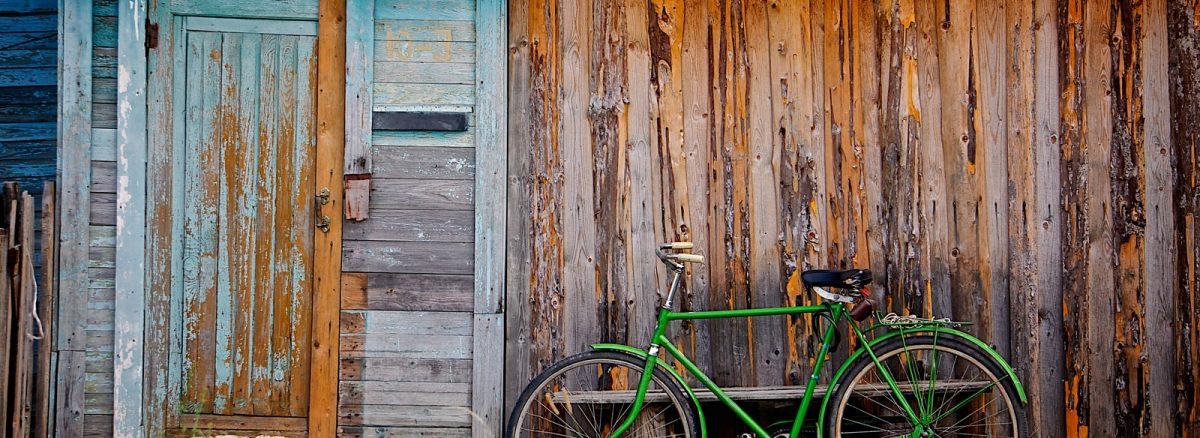 bicycle standing near house