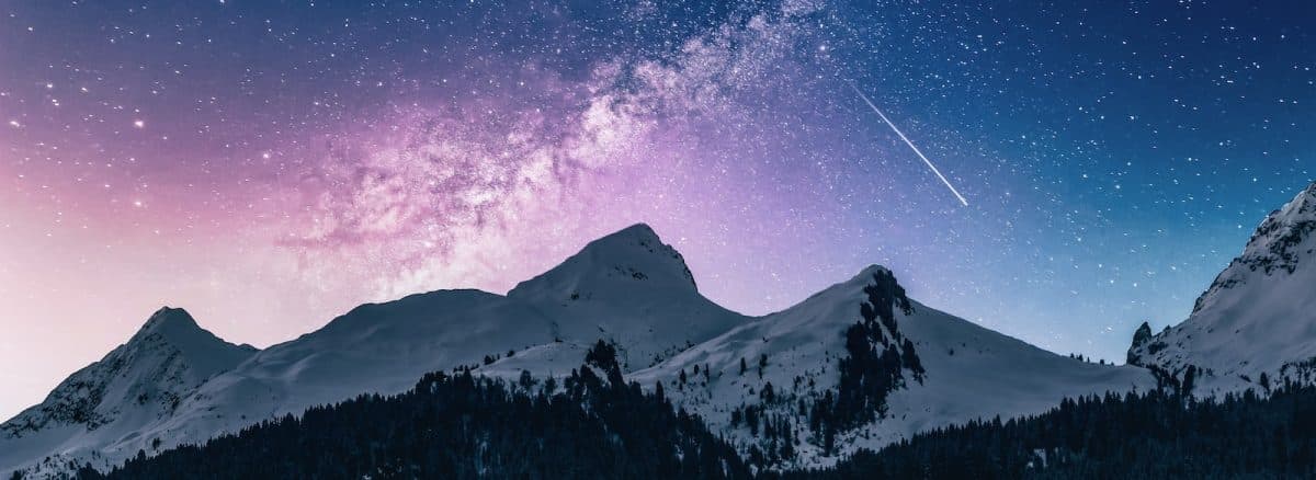 snow mountain under stars