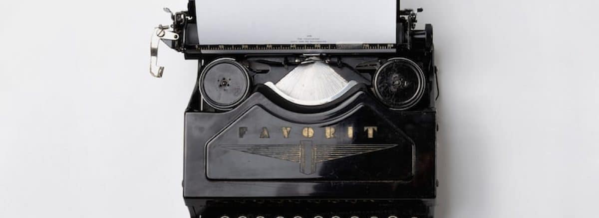 black Fayorit typewriter with printer paper