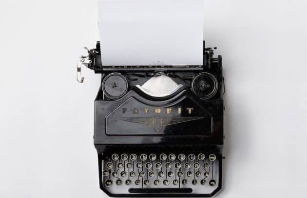 black Fayorit typewriter with printer paper