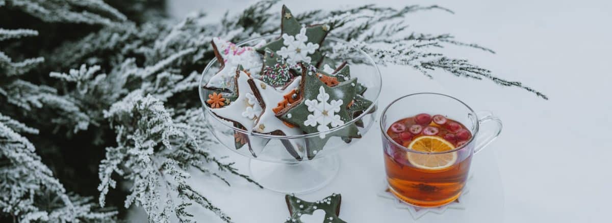 a glass of tea and some cookies on a table