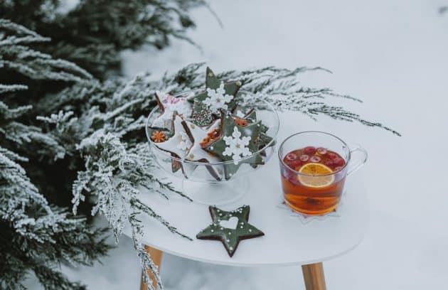 a glass of tea and some cookies on a table