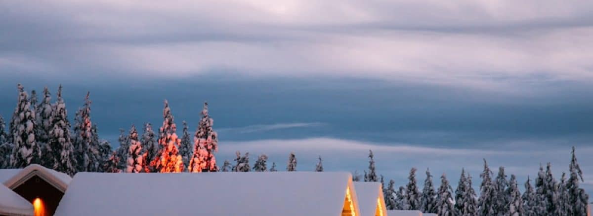 a house with a lot of snow on the ground