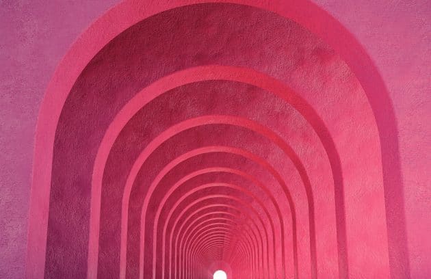a long tunnel with a light at the end of it
