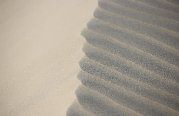 a close up of a sand dune in the desert